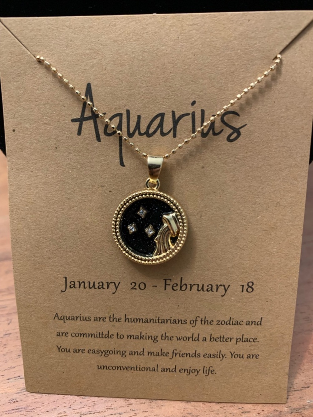 Aquarius Gold-Tone Zodiac Pendant Necklace - Black Accent